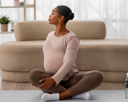 Pregnant lady sitting on floor