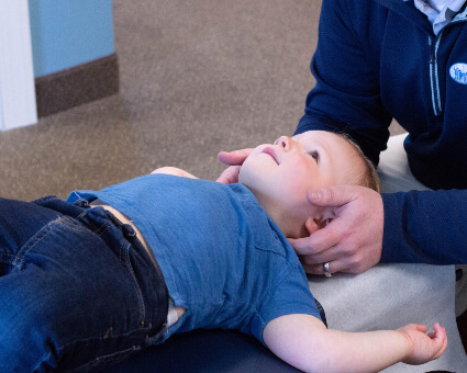 Pediatric patient receiving a chiropractic adjustment