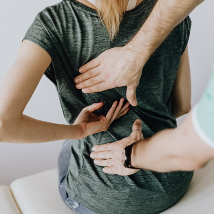 low back pain woman with chiro
