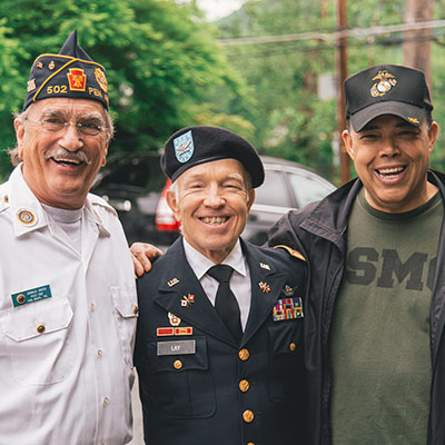 three veterans smiling
