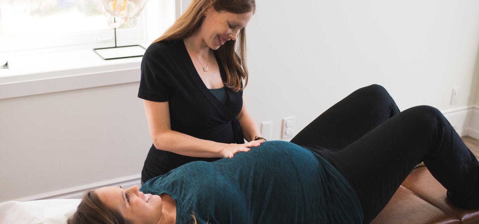 Guelph chiropractor adjusting a pregnant patient