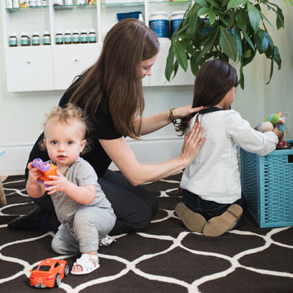 Dr. Alyssa examining child