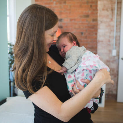 Dr. Alyssa with newborn