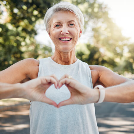 Woman making heart shape with hands