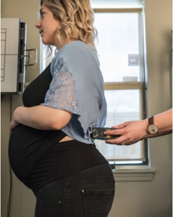 Pregnant woman getting adjusted