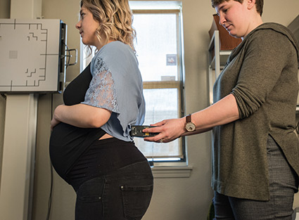 Pregnant woman getting adjustment