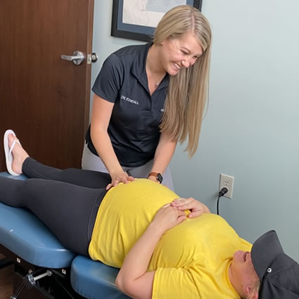 Dr Kendall adjusting pregnant patient