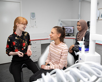 Dentist talking to patient