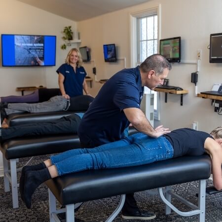 Patients receiving chiropractic adjustments