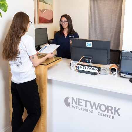 Patients checking in at front desk