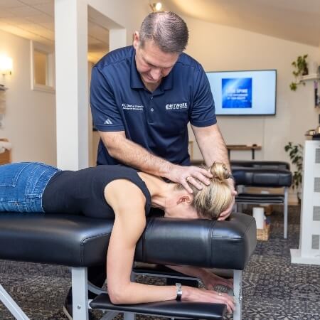 Female patient chiropractic head adjustment