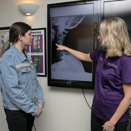 dr richelle pointing at xray