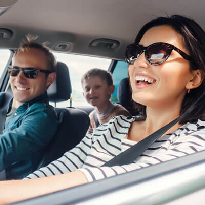family-laughing-in-car-sq-400