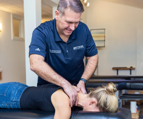 Doctor massaging patient