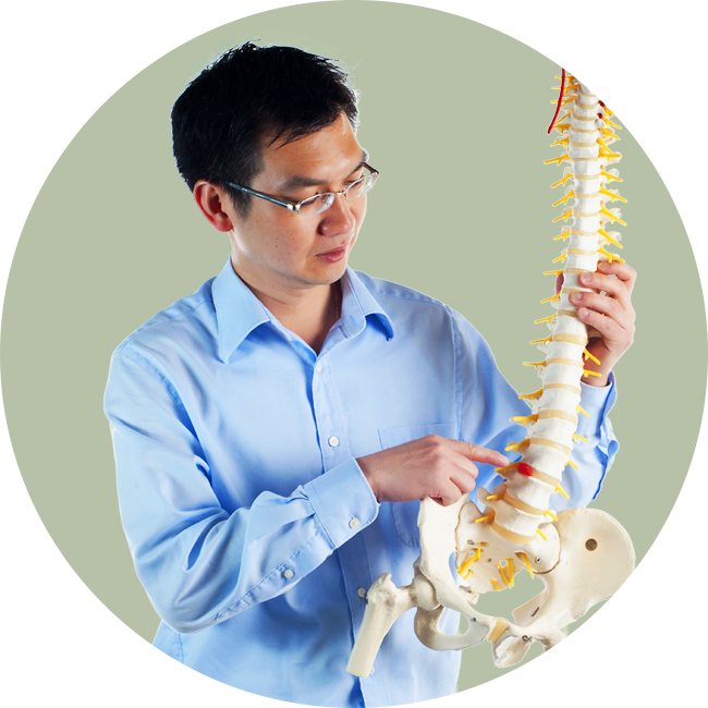 Dr. Ket Lu holding spine model