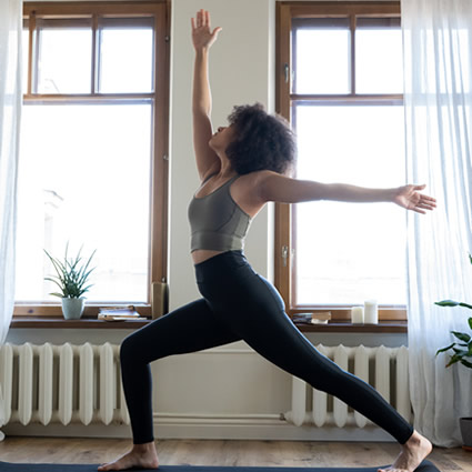 woman stretching at home