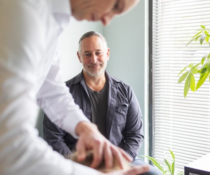 chiropractor with patient