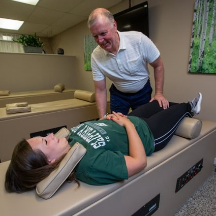 Doctor adjusting patient