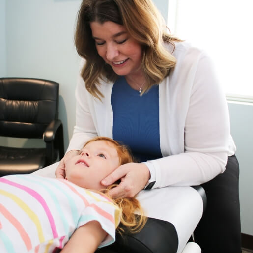 Evansville chiropractor adjusting a young girl