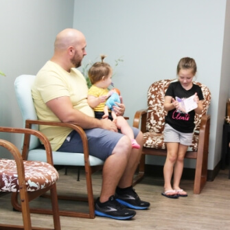 Evansville patients sitting in Dickinson Chiropractic & Acupuncture waiting room