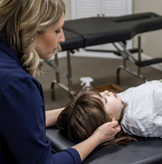 Assistant scanning patient's neck