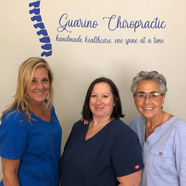 Team by Guarino Chiropractic sign