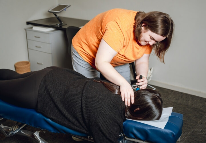 Chiropractor checking patient