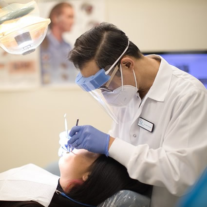 Dr. Jimmy working on patient