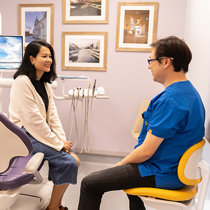 Dr Andrew consulting with patient