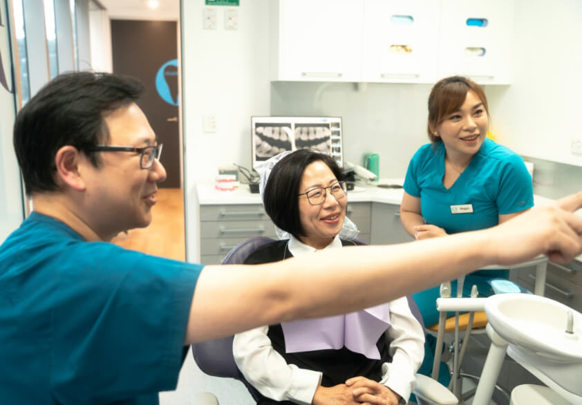 St Leonards Dentist Dr Lau talking with patient