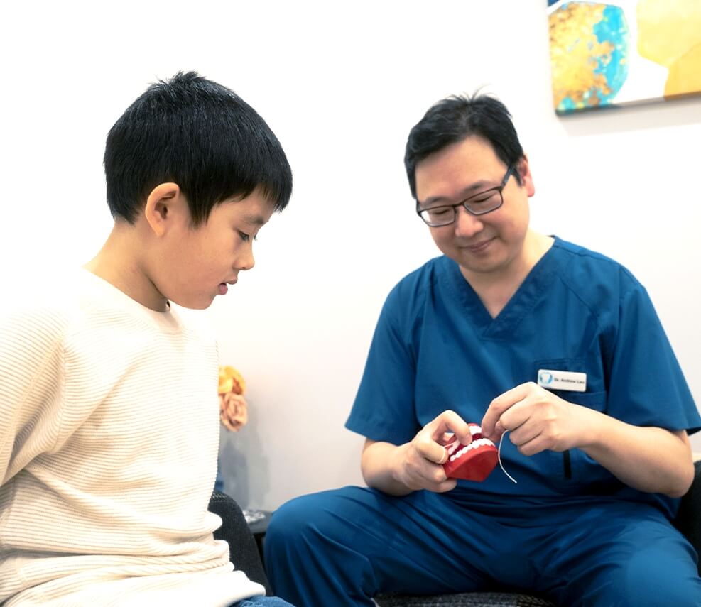 St Leonards Dentist Dr Andrew talking with boy patient