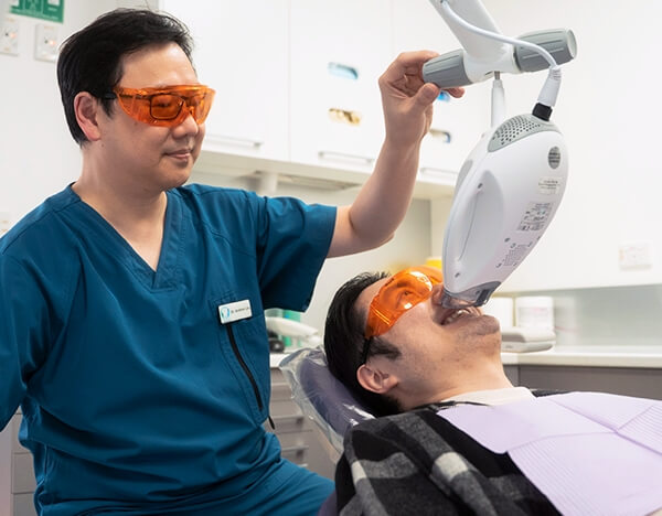 St Leonards dentist Dr Lau scanning patients mouth