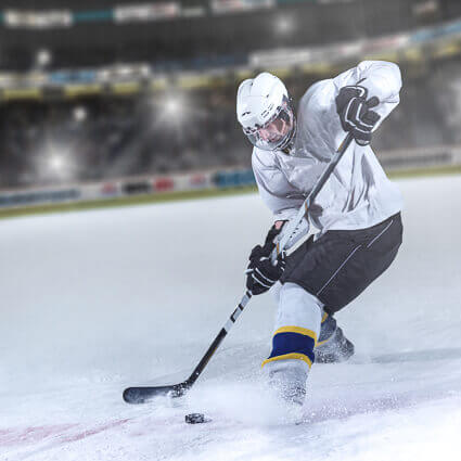 adult ice hockey player in action shot