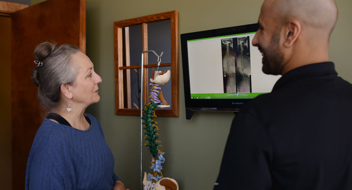 Victoria chiropractor reviewing x-rays