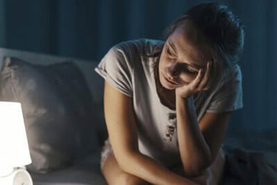 woman-with-insomnia-staring-at-clock