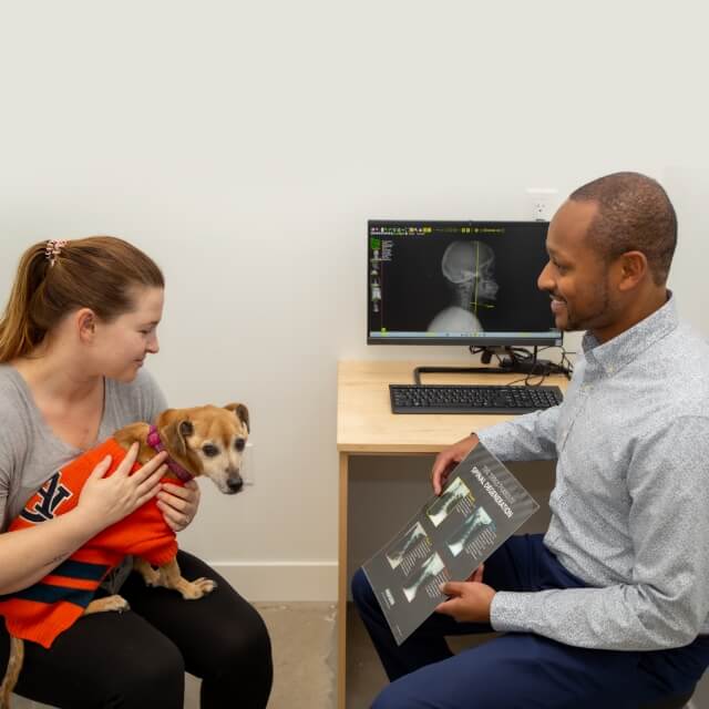 Dr. Tate showing x-rays to a patient