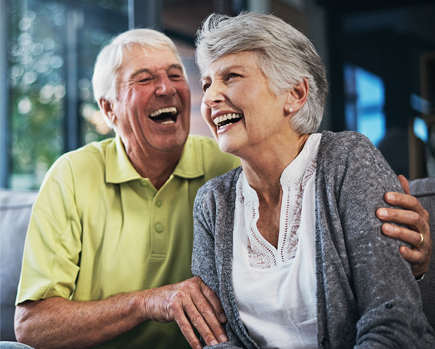 Elderly couple laughing