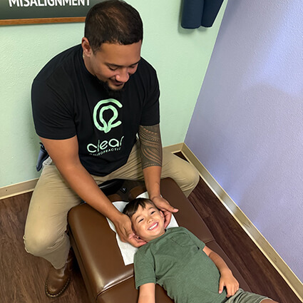 Doctor-adjusting-child