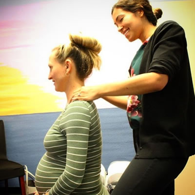Pregnant mum getting neck adjustment