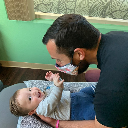 doctor adjusting baby boy