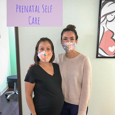 Mum at prenatal self care with doctor
