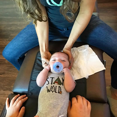 infant getting neck adjustment