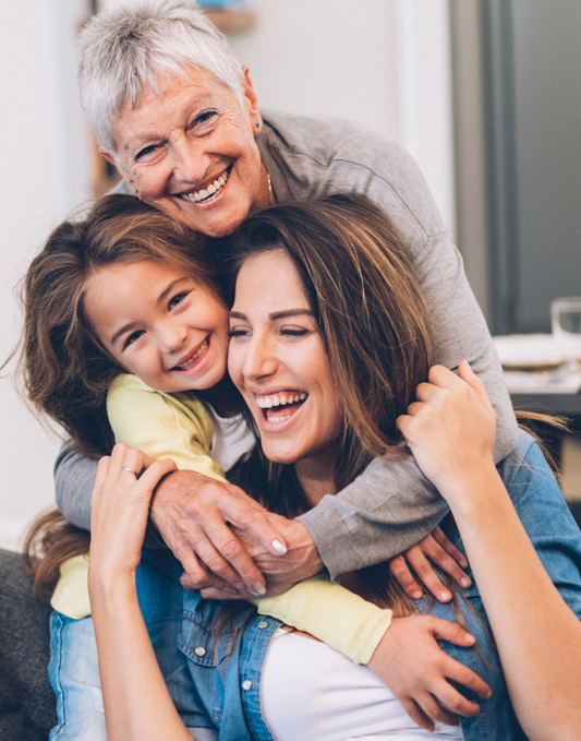 grandmother, daughter, and grand daughter smiling