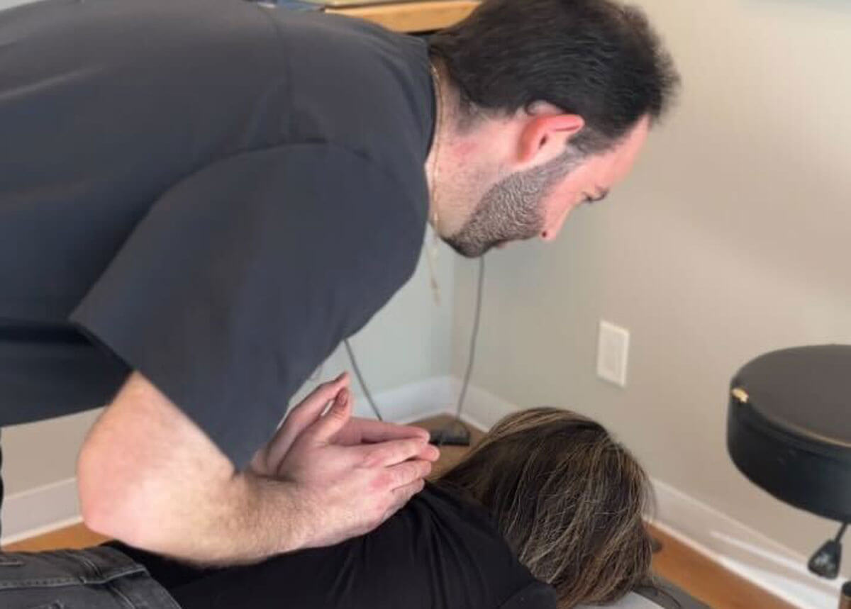 Dr. Ryan doing back adjustmet