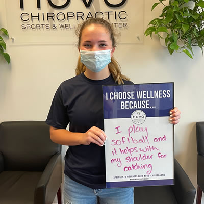 Football player patient holding sign