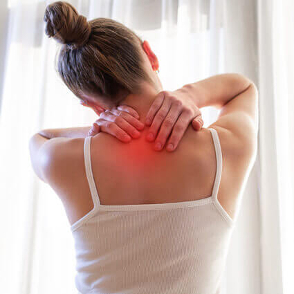 back-of-woman-with-hands-on-neck-in-pain-sq