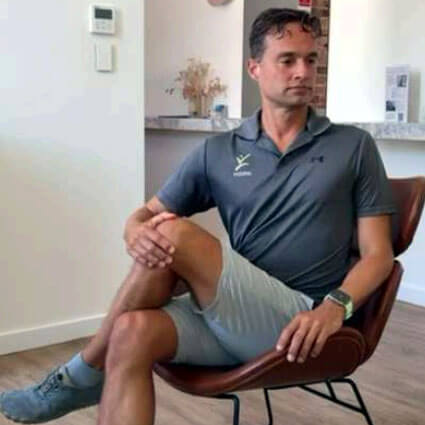 Man stretching in chair
