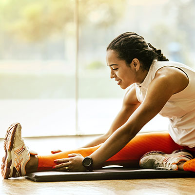 Woman stretching on mat