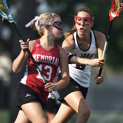 girls playing ball in the field