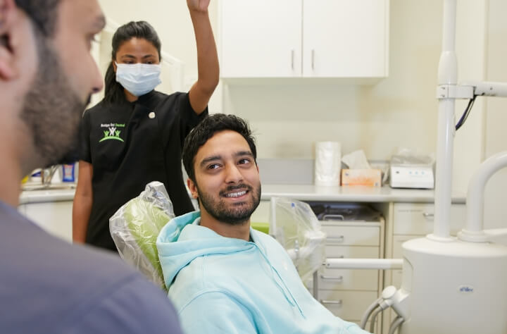 man looking at dentist